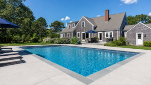 Beautifully renovated inground swimming pool with new coping and deck at a Barnstable Massachusetts home