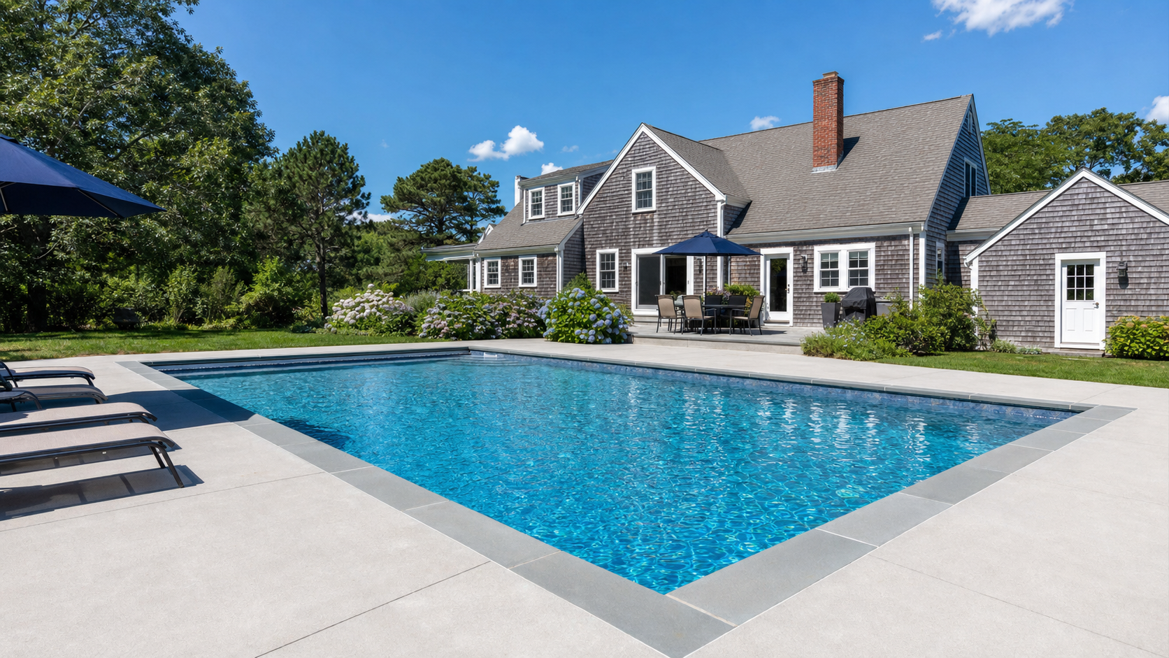 Beautifully renovated inground swimming pool with new coping and deck at a Barnstable Massachusetts home